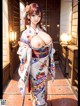 A woman in a kimono is posing for a picture.