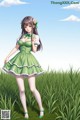 A girl in a green dress standing in a field of tall grass.