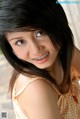 A woman with braces on her teeth posing for a picture.