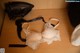 A white bra sitting on top of a wooden table.