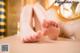 A woman's bare feet on a massage table.