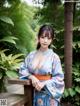 A woman in a blue kimono posing for the camera.