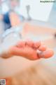 A person washing their hands with soap. 