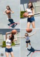 A woman holding a basketball on top of a basketball hoop.