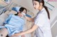 A nurse putting a mask on a patient's face.