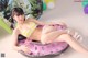 A woman in a bikini sitting on an inflatable pool float.